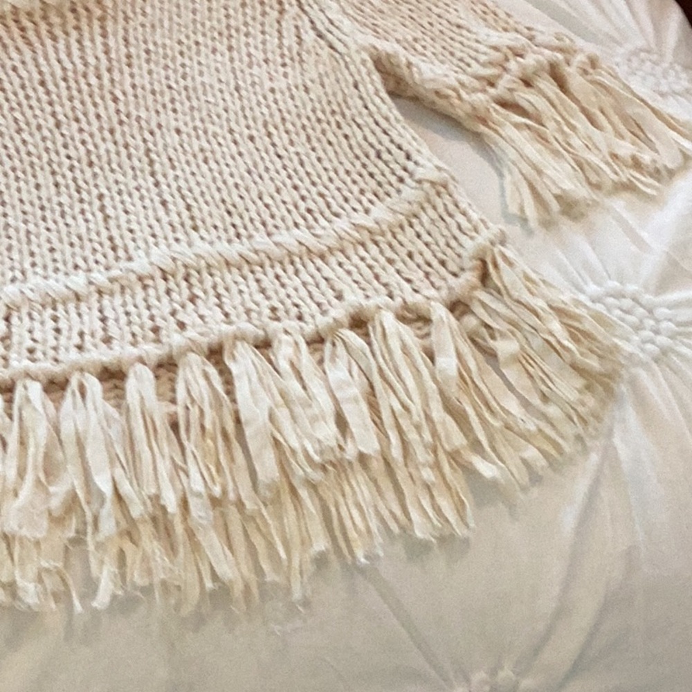 Beautiful cream sweater with fringe.